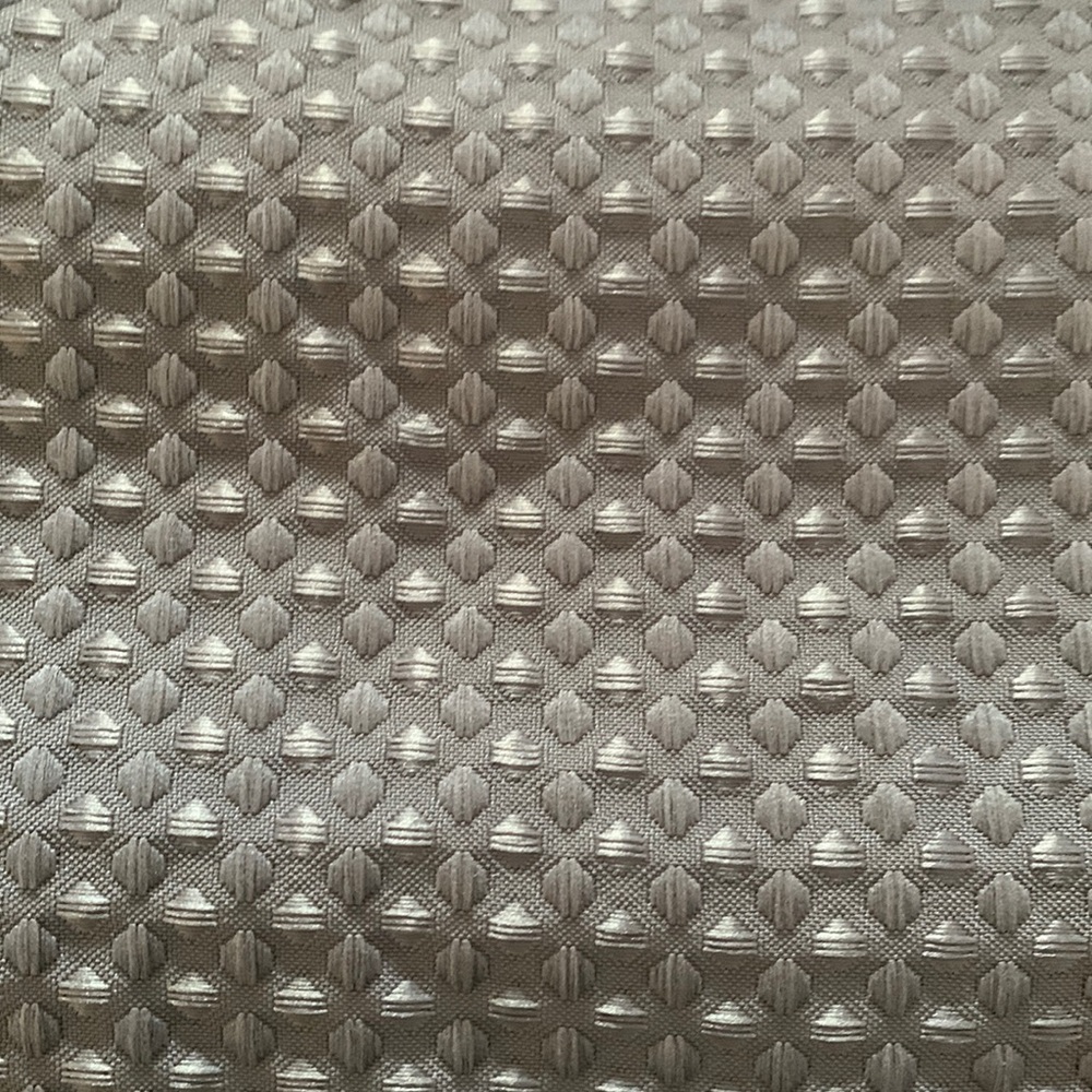 Grey fabric shower curtain with silver grommets